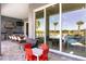 Inviting outdoor patio with a full kitchen, comfortable seating, and views of the pool and golf course beyond at 1514 Corolla Ct, Reunion, FL 34747