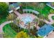 Aerial view of park with beautiful water feature and walking paths at 1514 Corolla Ct, Reunion, FL 34747