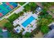 Aerial view of a pristine community pool and jacuzzi at 1514 Corolla Ct, Reunion, FL 34747