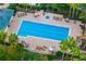 Aerial view of community pool and lounge area at 1514 Corolla Ct, Reunion, FL 34747