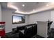 Enjoy movie nights in this home theater featuring comfortable seating and a convenient bar area with a popcorn machine at 1514 Corolla Ct, Reunion, FL 34747