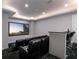 Home theater featuring a bar, theater chairs, and large screen offers an immersive viewing experience at 1514 Corolla Ct, Reunion, FL 34747