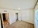 Neutral bedroom with plush carpeting, ample natural light, and closet at 5216 Greenheart Ave, Mount Dora, FL 32757