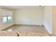 Bright living room featuring tile floors and a large window with natural light at 5216 Greenheart Ave, Mount Dora, FL 32757