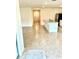 Open-concept living space with tile flooring connecting the kitchen to the front door at 5216 Greenheart Ave, Mount Dora, FL 32757