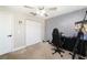 Bright bedroom featuring a ceiling fan, neutral walls, closet, and carpeted floors perfect for relaxing or studying at 13257 Sw 29Th Cir, Ocala, FL 34473