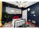Stylish bedroom with bold decor, fan, and playful design accents, creating an imaginative space at 13257 Sw 29Th Cir, Ocala, FL 34473