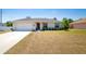 Charming single-story home with a well-manicured lawn, inviting entrance, and attached two-car garage at 13257 Sw 29Th Cir, Ocala, FL 34473