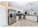 Well-equipped kitchen with stainless steel appliances, pantry, and ample cabinet space at 13257 Sw 29Th Cir, Ocala, FL 34473