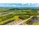 Stunning aerial view of a home nestled within a lush, green community with beautiful lakes and golf course views at 3153 Legends Preserve Dr, Daytona Beach, FL 32124