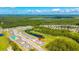 Lovely aerial view of a home in a vibrant community, complete with a golf course, and scenic water views at 3153 Legends Preserve Dr, Daytona Beach, FL 32124