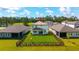 Aerial view of the rear of the home with a well-maintained lawn, and privacy fence at 3153 Legends Preserve Dr, Daytona Beach, FL 32124