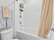 Inviting bathroom with a shower-tub combo, modern fixtures, and tile details at 3153 Legends Preserve Dr, Daytona Beach, FL 32124