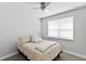 Bedroom with a neutral palette, providing a serene atmosphere, complemented by a window view at 3153 Legends Preserve Dr, Daytona Beach, FL 32124