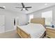 Comfortable bedroom featuring a ceiling fan, soft carpet, and a beautiful upholstered bed at 3153 Legends Preserve Dr, Daytona Beach, FL 32124