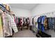 Walk-in closet with neatly organized shelving and rods for ample storage at 3153 Legends Preserve Dr, Daytona Beach, FL 32124