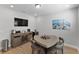 Dining area with neutral walls, wood-look floors, and a gray buffet with a beverage station at 3153 Legends Preserve Dr, Daytona Beach, FL 32124