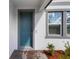Close up of a stylish blue front door and sidelight window at 3153 Legends Preserve Dr, Daytona Beach, FL 32124