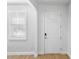 Bright entryway with light wood floors and a white door at 3153 Legends Preserve Dr, Daytona Beach, FL 32124