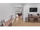 Long hallway leading into a living room with wood flooring at 3153 Legends Preserve Dr, Daytona Beach, FL 32124