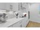 Kitchen featuring white cabinets, stainless appliances, quartz countertops, and stylish backsplash at 3153 Legends Preserve Dr, Daytona Beach, FL 32124