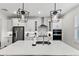 Modern kitchen featuring a large island with pendant lights, stainless steel appliances, and sleek white cabinetry at 3153 Legends Preserve Dr, Daytona Beach, FL 32124