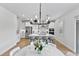 Open-concept kitchen with a large island with seating and a bright dining area, creating a seamless flow at 3153 Legends Preserve Dr, Daytona Beach, FL 32124