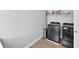 Modern laundry room with stainless steel washer and dryer at 3153 Legends Preserve Dr, Daytona Beach, FL 32124