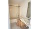Bathroom featuring a tub, toilet, sink, and tile floor at 323 Miami Ln, Kissimmee, FL 34759