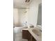 Bathroom with bathtub, shower, toilet, vanity and mirror at 323 Miami Ln, Kissimmee, FL 34759
