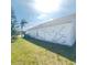 Exterior wall of home showing cosmetic damage and lawn at 323 Miami Ln, Kissimmee, FL 34759