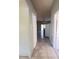 Hallway leading to the living area and kitchen at 323 Miami Ln, Kissimmee, FL 34759