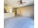 Open concept living room with tile flooring and neutral paint at 323 Miami Ln, Kissimmee, FL 34759
