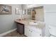 Bathroom with a granite countertop vanity, a shower, and a turtle-themed picture at 5003 Timber Ridge Trl, Ocoee, FL 34761