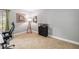 Bedroom with a neutral wall color and carpet with a desk, chair, mirror, and other decorations at 5003 Timber Ridge Trl, Ocoee, FL 34761
