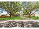 Inviting single Gathering home with mature shade trees, lush lawn, and a long driveway at 5003 Timber Ridge Trl, Ocoee, FL 34761