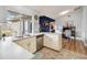 Functional kitchen with white cabinets, stainless steel appliances, and a view of the backyard at 5003 Timber Ridge Trl, Ocoee, FL 34761