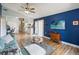 Open living space featuring wood floors, comfortable seating, and access to the kitchen at 5003 Timber Ridge Trl, Ocoee, FL 34761