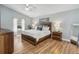 Spacious main bedroom with wood furnishings, large windows, and vaulted ceilings at 5003 Timber Ridge Trl, Ocoee, FL 34761