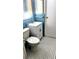 Bathroom featuring tiled walls, updated vanity, and contrasting tile flooring at 902 S Scenic Hwy, Lake Wales, FL 33853