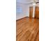 Bedroom featuring hardwood floors, window with blinds, and spacious closets at 902 S Scenic Hwy, Lake Wales, FL 33853