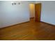 Simple bedroom with hardwood floors and minimalist lighting at 902 S Scenic Hwy, Lake Wales, FL 33853
