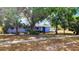 Cozy home with mature trees in the front yard at 902 S Scenic Hwy, Lake Wales, FL 33853