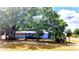 Charming single-story home with mature trees and a lawn at 902 S Scenic Hwy, Lake Wales, FL 33853