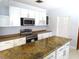 Modern kitchen with stainless steel appliances and an island at 902 S Scenic Hwy, Lake Wales, FL 33853