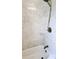 Close-up of shower showcasing a modern shower head and marble-tiled walls at 902 S Scenic Hwy, Lake Wales, FL 33853