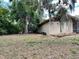 Spacious backyard showcasing the natural beauty of the surrounding trees at 246 Ridge Manor Dr, Lake Wales, FL 33853