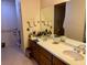 Bathroom featuring double sinks, large vanity, and large mirror at 246 Ridge Manor Dr, Lake Wales, FL 33853