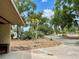 Exterior view showcasing the driveway and landscaping surrounding the property at 246 Ridge Manor Dr, Lake Wales, FL 33853