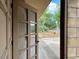 Inviting entryway featuring a partial view through an open door and lush greenery at 246 Ridge Manor Dr, Lake Wales, FL 33853
